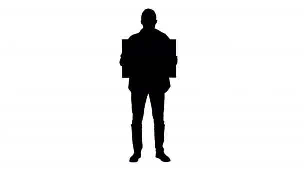 Silhouette Giovane uomo in abbigliamento casual in possesso di bordo spazio copia . — Video Stock