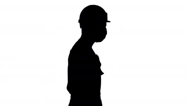 Siluet İnşaat işçisi. Şapka ve maske takıyor.. — Stok video