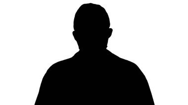 Şapkalı ve maskeli bir Amerikan silueti yürüyordu..