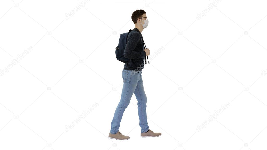 Student in protective masks walking with backpack on white background.
