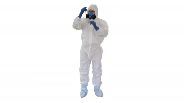 Doctor in Hazmat Suit and Gas Mask Holding Test Tube of Blood on white background. — Stock Video