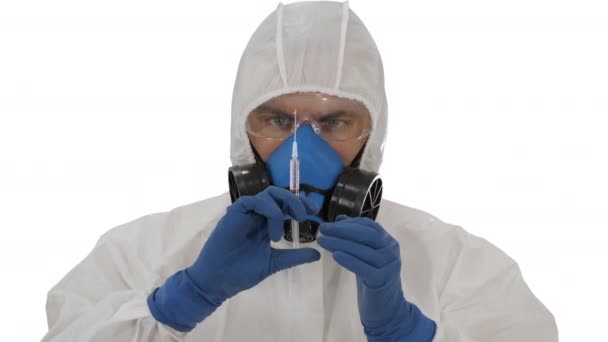 Scientist in protective gear holding syringe with injection on white background. — Stock Video