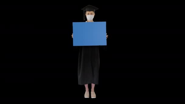 Graduate student girl in protection mask holding blank board, Alpha Channel — Stock Video