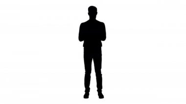 Siluet Coronavirus. Koruyucu maske takan adam ellerini dezenfektanla temizliyor..