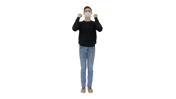 Joyful happy man taking off his protective mask The coronavirus pandemic epidemic is over on white background. — Stock Photo, Image