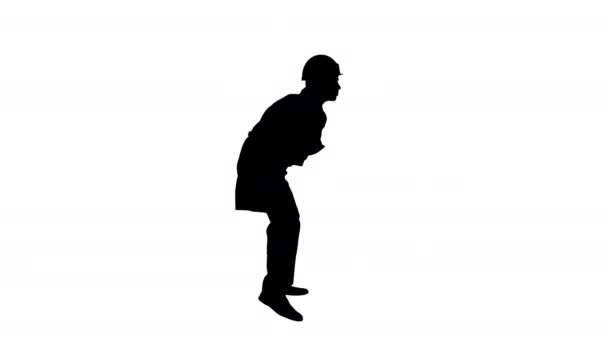 Silhouette Joven obrero con casco en bata blanca disfruta bailando . — Vídeo de stock