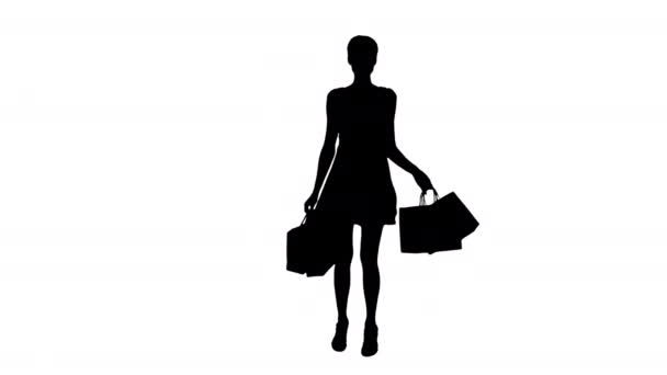 Silhuett kvinna poserar på kameran med flerfärgade shoppingväskor. — Stockvideo