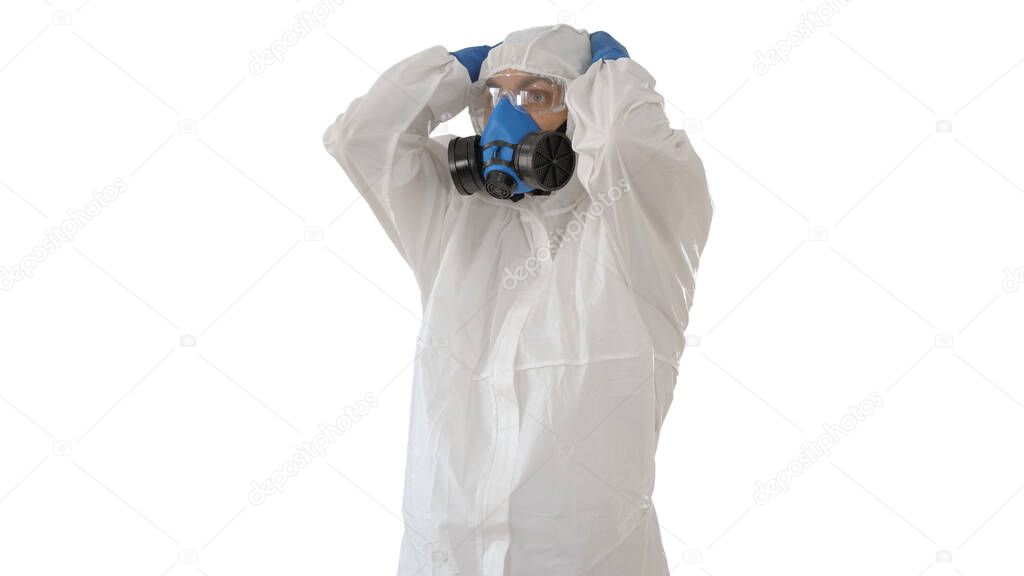 Doctor in protective clothes holds his head on white background.