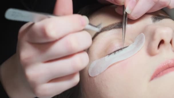 Eyelash Extension Procedure. Woman Eye with Long Eyelashes. Lashes, close up. — Stock Video