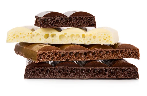 Dark, milk and white porous chocolate — Stock Photo, Image