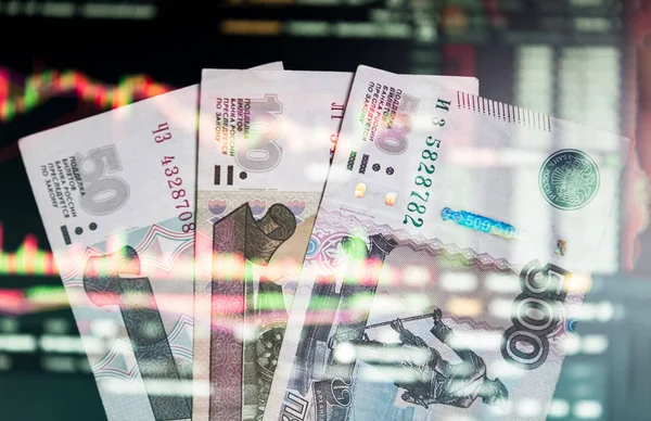 The Russian ruble on the background of the trading chart. A thou — Stock Photo, Image