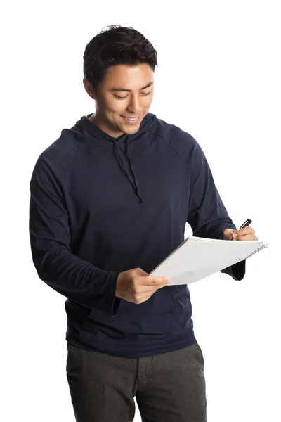 Smiling man with pen and paper — Stock Photo, Image