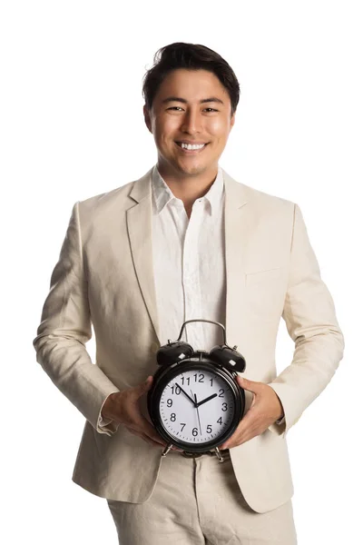 Handsome businessperson holding clock — Stock Photo, Image