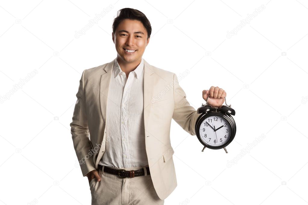 Handsome businessperson holding clock