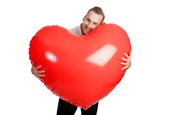 Man with big heart smiling towards camera — Stock Photo, Image