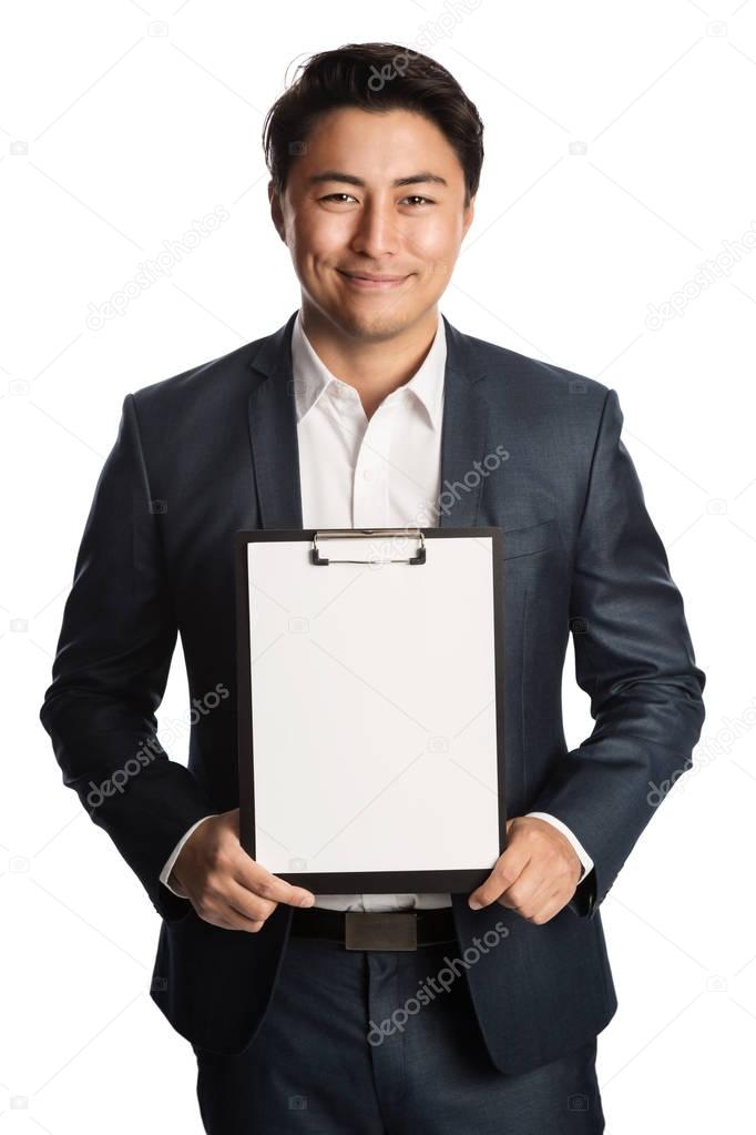 Handsome businessman in blue suit with clipboard