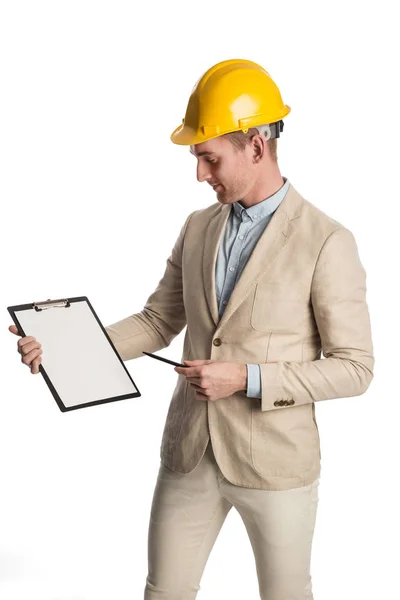 Attractive construction foreman with clipboard smiling — Stock Photo, Image