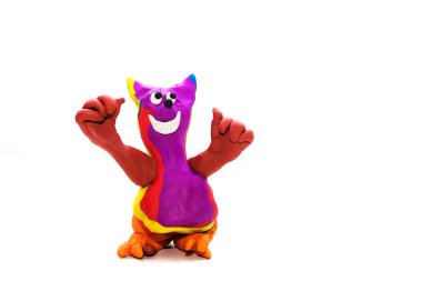 Hafif arka plandaki bir kediyi andıran plastik biblo.