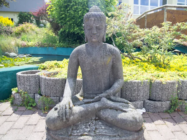 Female Budha statue portrait. Concept: Meditation, Religion, Ancient.