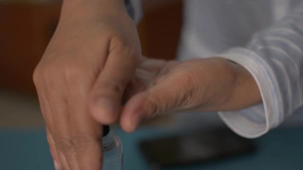 Close Woman Dispensing Hand Sanitizer Hands Sanitizing Them Using Mobile — Stockvideo