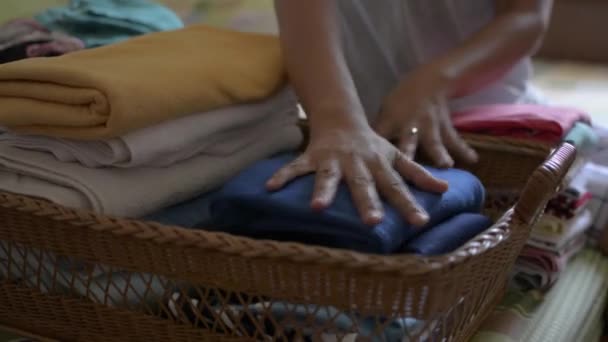 Woman Folding Clothes Putting Wooden Basket Housewife Doing Some House — Stock Video