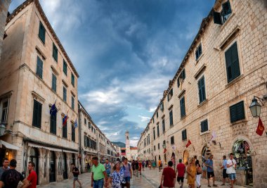 People at street cafe with lantern illuminated at night in Dubrovnik, Croatia