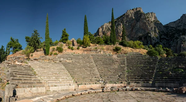 Ancient theatre of Delphi with temple of Apollo , panoramic view from above