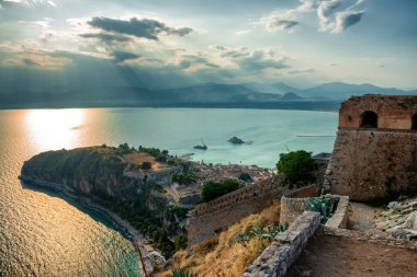Breathtaking view from the top of Palamidi fortress above the city of Nafplion in Greece in the late afternoon clipart