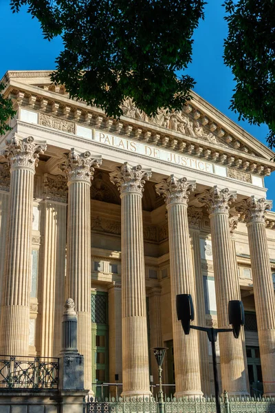 Court house, or Palais de Justice (1846) - imposing neoclassical monument of Nimes city in France. It has a powerful colonnade overlooking Charles-de-Gaulle esplanade.
