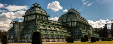 Green house Palmenhaus Schonbrunn in Schonbrunn palace park. Opened in 1882, it is the most prominent of the four greenhouses in Schonbrunn Palace Park clipart