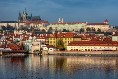 Scenic view on Vltava rive, Charles bridge and historical center of Prague, buildings and landmarks of old town