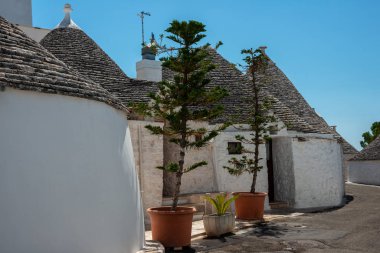 Glimpses of city streets in Alberobello between the Trulli, Italy