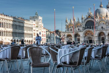 Waiter at Cafe Florian on the Piazza San Marco or St Mark`s Square in Venice, Checking Menu Card.