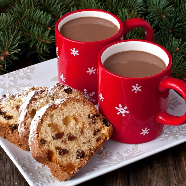 Holidays cake with raisins  and hot chocolate mug — Stock Photo, Image