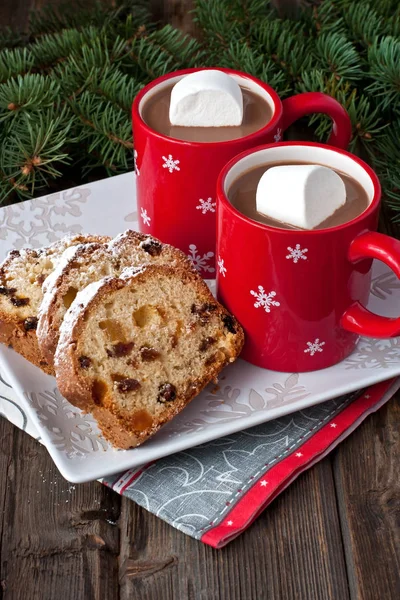 Holidays cake with raisins  and hot chocolate mug — Stock Photo, Image