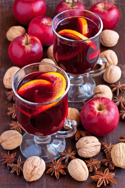 Glass with mulled wine and spices — Stock Photo, Image
