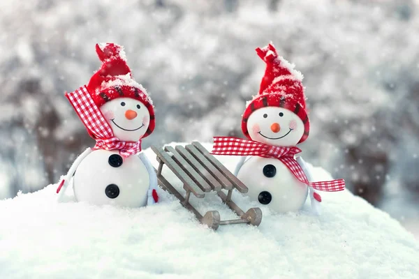 Two smiling snowmen friends in the snow — Stock Photo, Image