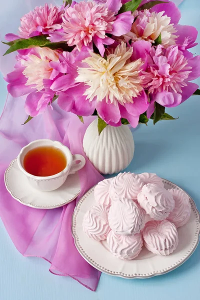 Summer  composition with peonies ,cookies and tea cup Stock Image