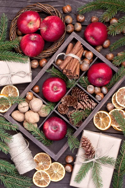 Holidays composition with christmas fruits, nuts and gift box — Stock Photo, Image