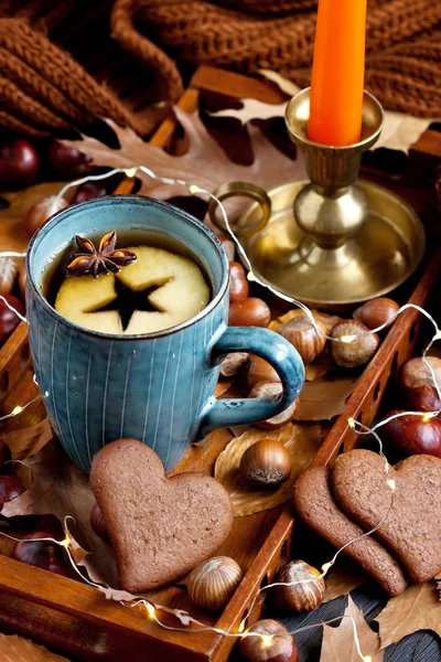 Cup of tea, apple, spices, nuts and  cookies — Stock Photo, Image