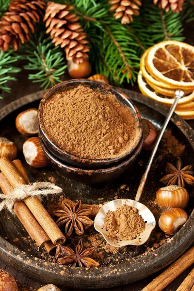 Cocoa powder and spices on wooden background — Stock Photo, Image