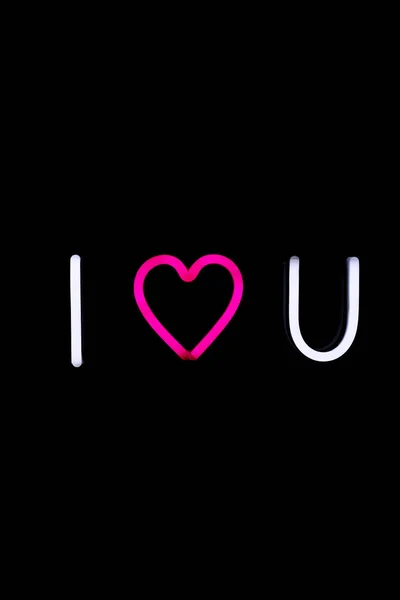 White and pink i love you neon sign on isolated black background. — 스톡 사진