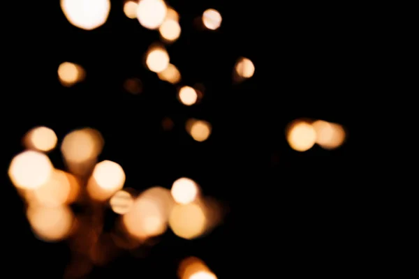 Golden abstract bokeh sparkle on black isolated background. Holiday concept. — Stock Photo, Image