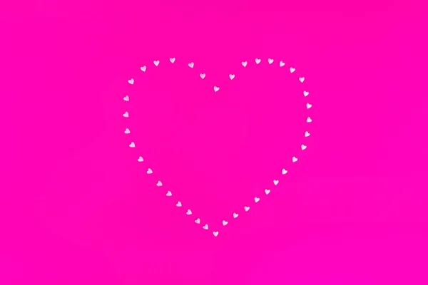 Bright pink background. Pink hearts on a pink background. Hearts sprinkles. Valentine day. — 스톡 사진