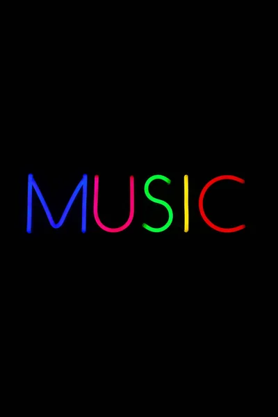 Mehrfarbiges Musikschild auf isoliertem schwarzen Hintergrund. — Stockfoto