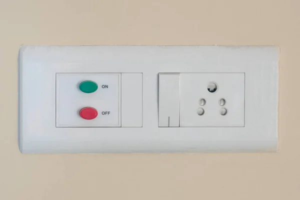 Modern modular switchboard with on/off switch, 3 pin socket and — 图库照片
