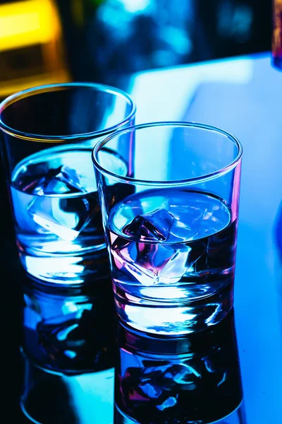 Drinking glasses close-up on a dark background — Stock Photo, Image