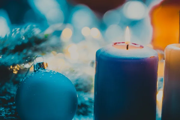 Christmas decoration with bauble and candle for advent season four candles burning — Stock Photo, Image