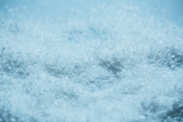 white snow background close up with a blue tone