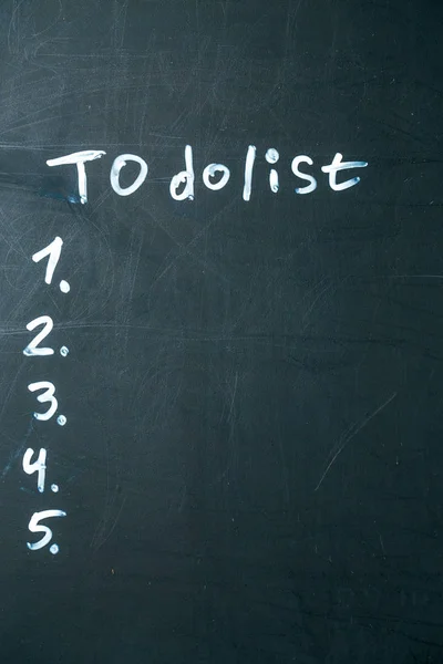 Inscription do it list drawn with chalk on a school blackboard dark — Stock Photo, Image